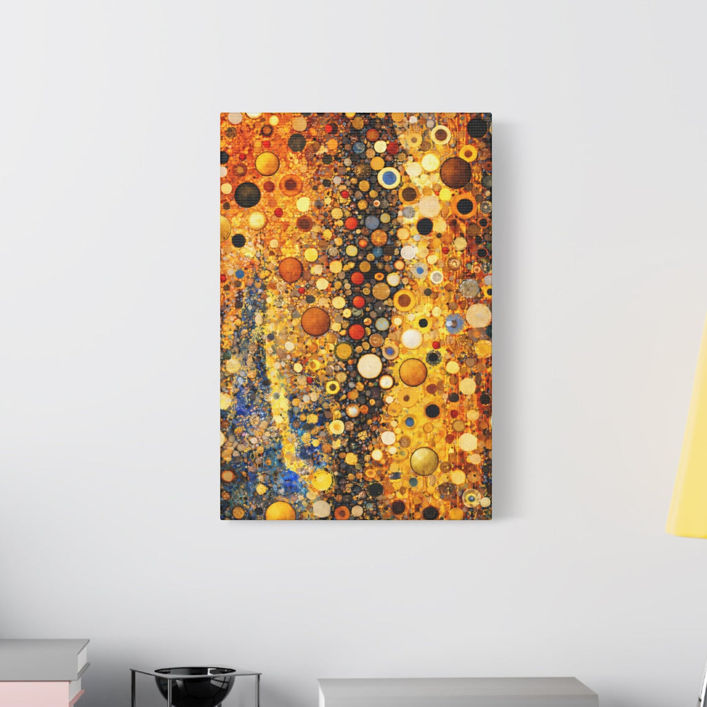 Abstract art piece on a wall above a table with books and a lamp.