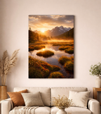 Canvas print of a mountain landscape with a sunset over a lake, hanging above a sofa in a living room.