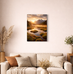Landscape painting of a sunset over a mountain lake in a living room.