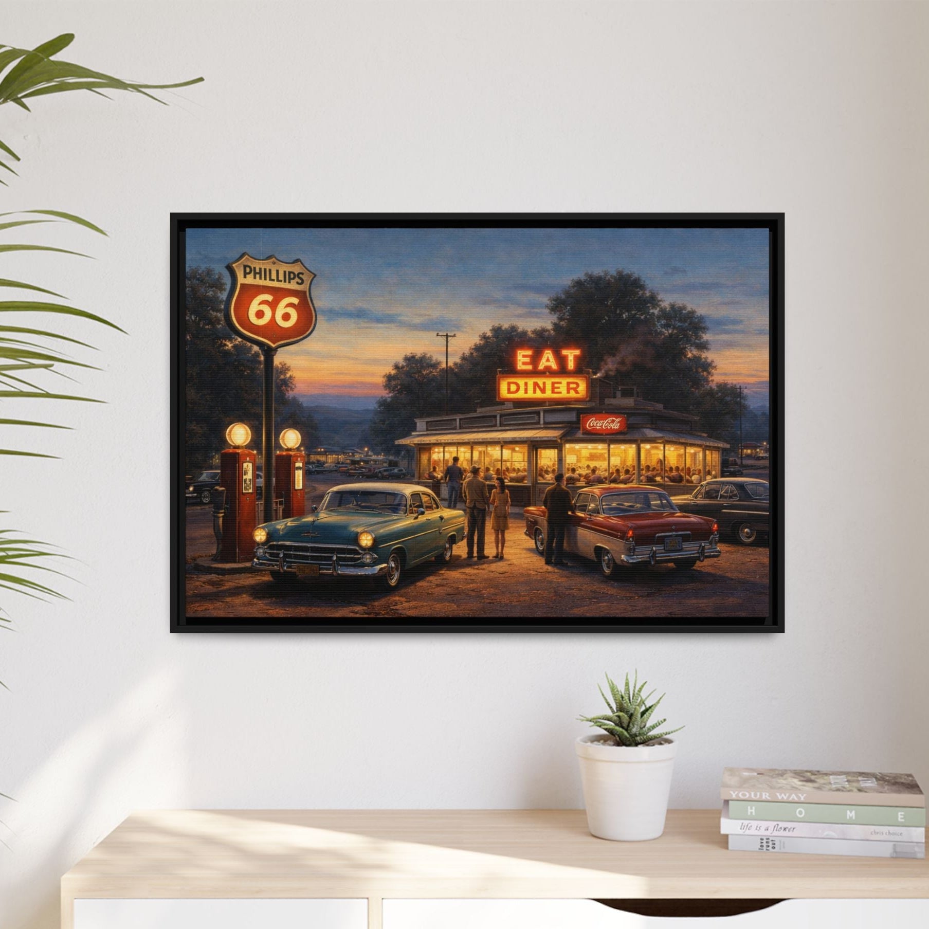 Vintage automobiles gather outside a glowing diner and gas station beneath a Phillips 66 sign