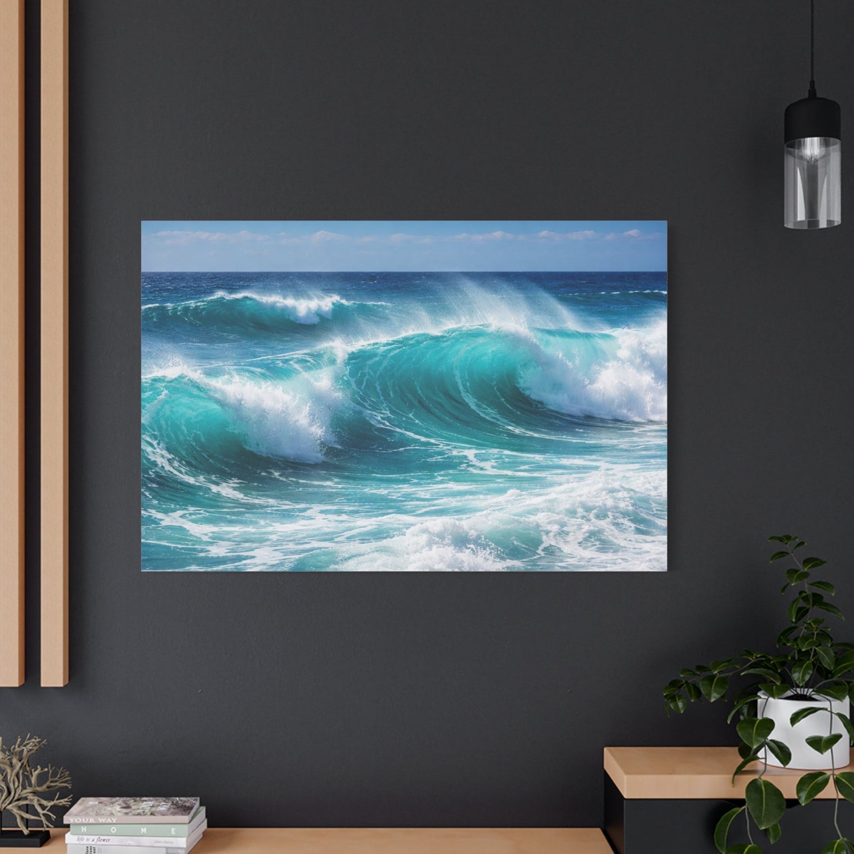 Framed photograph of ocean waves on a dark wall with wooden shelves and decor.