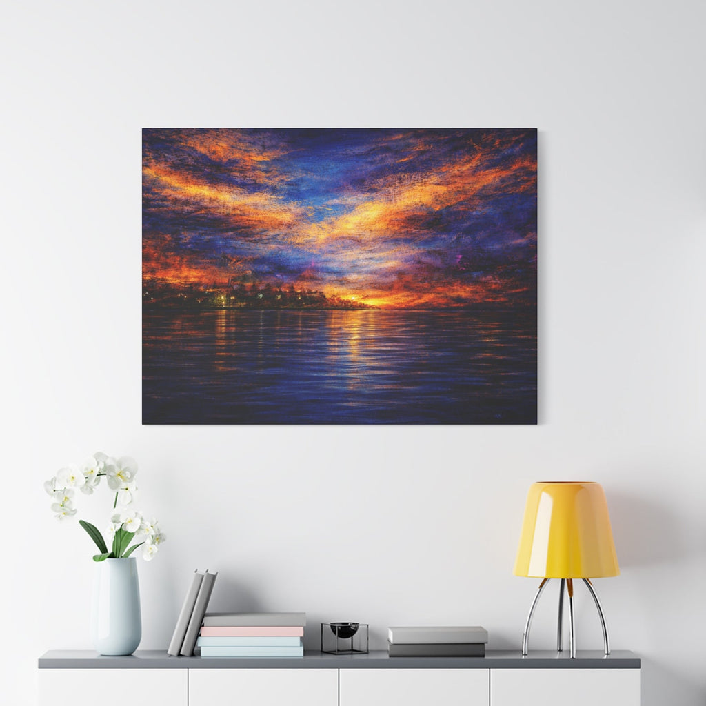 Framed abstract artwork of a sunset over water hanging on a white wall above a desk.