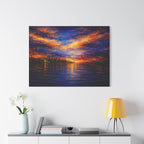 Framed abstract artwork of a sunset over water hanging on a white wall above a desk.