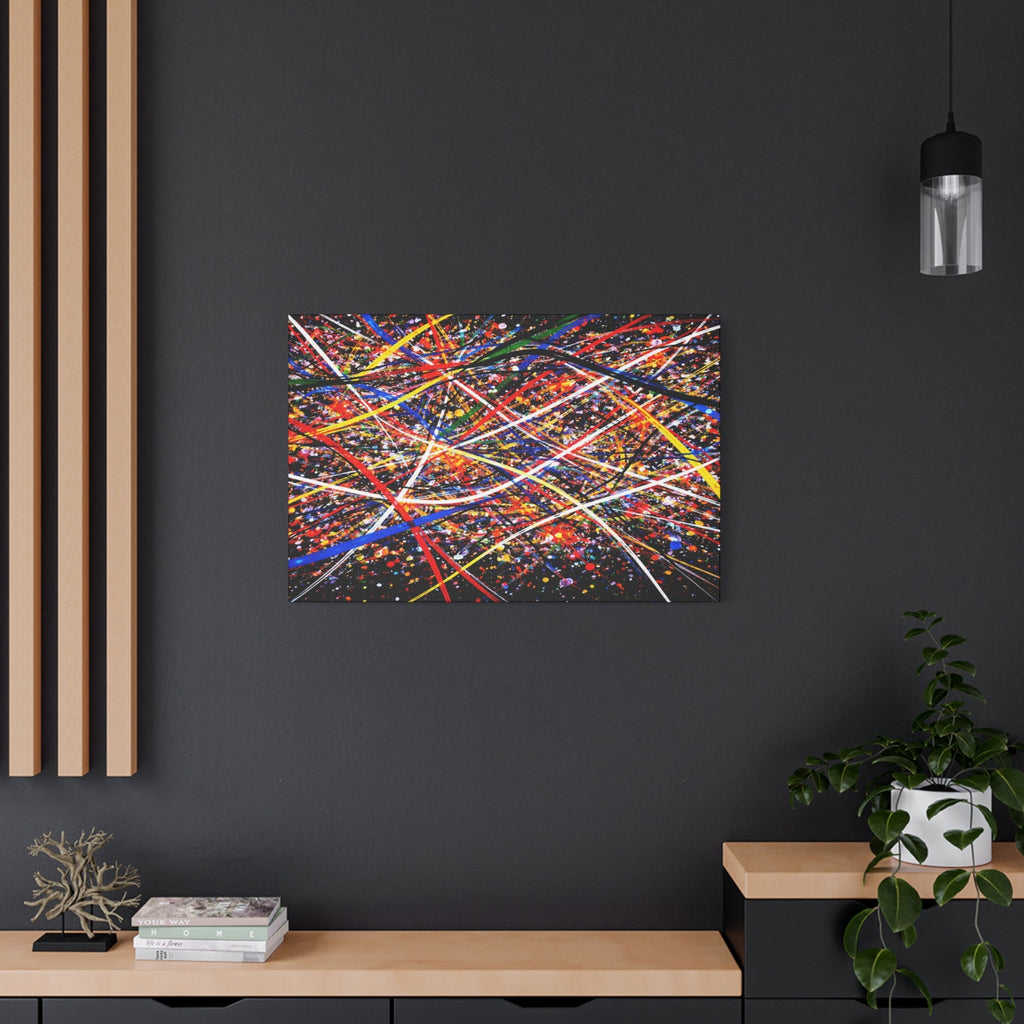 Abstract colorful painting on a dark wall with a wooden shelf and plant in the foreground.