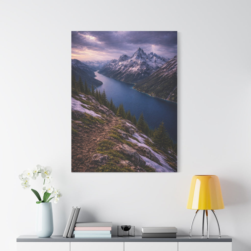 Scenic mountain landscape print on a white wall above a cabinet with decor items.